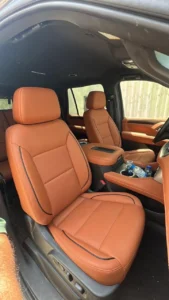 Custom red leather car seat upholstery in Oman